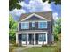 Two-story blue house with porch at 19 Hydrangea Unit 71 Way, Auburn, GA 30011