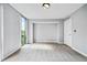 Bright bedroom with large window and neutral wall paint at 2870 Pharr Court South Nw # 607, Atlanta, GA 30305