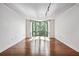 Bright living room with hardwood floors and wall-to-wall windows at 2870 Pharr Court South Nw # 607, Atlanta, GA 30305