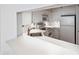 White kitchen with a pass-through window to the living area at 2870 Pharr Court South Nw # 607, Atlanta, GA 30305
