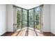 Sunlit living room featuring corner windows and hardwood floors at 2870 Pharr Court South Nw # 607, Atlanta, GA 30305