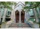 Modern building exterior with double wood doors and landscaping at 2870 Pharr Court South Nw # 607, Atlanta, GA 30305