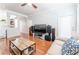 Living room with hardwood floors, TV, and comfortable seating at 1850 Cotillion Dr # 3123, Dunwoody, GA 30338