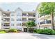 Building exterior with multiple levels, balconies, and landscaping at 1850 Cotillion Dr # 3123, Dunwoody, GA 30338