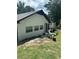 White brick ranch house with black accents, updated landscaping, and walkway at 3503 Larkspur Ter, Decatur, GA 30032