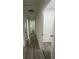 Bright hallway with hardwood floors and multiple doors at 3503 Larkspur Ter, Decatur, GA 30032