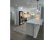 Modern white kitchen with large island and stainless steel appliances at 3503 Larkspur Ter, Decatur, GA 30032
