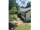 White brick house exterior showcasing side yard and walkway at 3503 Larkspur Ter, Decatur, GA 30032