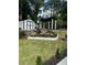 Landscaped backyard with shed, pergola, and stone retaining wall at 3503 Larkspur Ter, Decatur, GA 30032