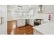 Modern white kitchen with stainless steel appliances and an island at 1875 Langston Sw Ave, Atlanta, GA 30310