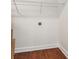 Laundry closet with wire shelving and wood flooring at 1875 Langston Sw Ave, Atlanta, GA 30310