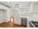 Updated kitchen with white cabinets, stainless steel appliances, and island at 1875 Langston Sw Ave, Atlanta, GA 30310
