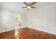 Hardwood floor bedroom with ensuite bathroom and soaking tub at 1875 Langston Sw Ave, Atlanta, GA 30310