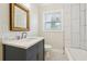 Bathroom with updated vanity and a shower/tub combo at 1875 Langston Sw Ave, Atlanta, GA 30310