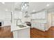 Updated kitchen with white cabinets, quartz countertops, and island at 1875 Langston Sw Ave, Atlanta, GA 30310