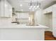 Modern kitchen with white cabinets and quartz countertops at 1875 Langston Sw Ave, Atlanta, GA 30310