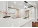 Modern white kitchen with stainless steel appliances and island at 1875 Langston Sw Ave, Atlanta, GA 30310