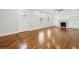Hardwood floors, fireplace, and built-in shelving in this living room at 1875 Langston Sw Ave, Atlanta, GA 30310