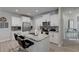 Modern kitchen with white cabinets, granite island, and stainless steel appliances at 5142 Longview Run, Decatur, GA 30035
