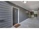 Exterior hallway with gray siding and condo unit entrances at 6209 Santa Fe Pkwy, Sandy Springs, GA 30350