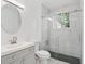 Modern bathroom with marble tile shower and gray vanity at 1410 Elizabeth Sw Ave, Atlanta, GA 30310