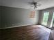 Bright bedroom with wood-look floors, ceiling fan and access to patio at 2288 Hudson, Lilburn, GA 30047