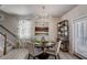 Charming dining room with a chandelier and access to a patio at 5150 Longview Run, Decatur, GA 30035