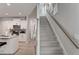 Modern staircase with light gray carpeting and wooden railing at 5150 Longview Run, Decatur, GA 30035