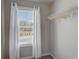 Walk-in closet with window, hanging rod, and neutral decor at 5150 Longview Run, Decatur, GA 30035