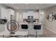 Modern kitchen with white cabinets and granite island at 5150 Longview Run, Decatur, GA 30035