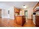 Kitchen island with granite countertop and wooden cabinets at 4415 Ashford Pl, Douglasville, GA 30135