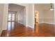 Hardwood floor entryway, with views of the kitchen and back door at 4415 Ashford Pl, Douglasville, GA 30135