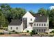 Modern farmhouse exterior with gray and white siding at 235 Winterberry Way, Roswell, GA 30075
