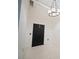 Modern entryway with a black door and updated lighting at 20 Marietta Nw St # 3G, Atlanta, GA 30303