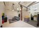 Open living area with exposed brick, high ceilings, and an industrial feel at 20 Marietta Nw St # 3G, Atlanta, GA 30303