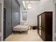 Cozy bedroom with dark accent wall and mirrored closet at 20 Marietta Nw St # 3G, Atlanta, GA 30303