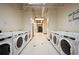 Clean laundry room with multiple machines at 20 Marietta Nw St # 3G, Atlanta, GA 30303