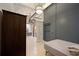Small bedroom with a twin bed and view into the living area at 20 Marietta Nw St # 3G, Atlanta, GA 30303