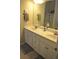 Bathroom boasts double vanity sinks and a large mirror at 40 Templeton Ln, Villa Rica, GA 30180