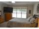 Spacious main bedroom with large windows, a ceiling fan, and a king-size bed at 40 Templeton Ln, Villa Rica, GA 30180