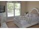 Bedroom with a queen-size bed, dresser, and large window at 40 Templeton Ln, Villa Rica, GA 30180