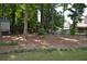 Wooded backyard with gravel landscaping at 40 Templeton Ln, Villa Rica, GA 30180