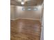 Spacious bedroom with hardwood floors and recessed lighting at 4430 Vernon Nw St, Lilburn, GA 30047