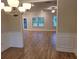Open dining room with hardwood floors and access to the living room at 4430 Vernon Nw St, Lilburn, GA 30047