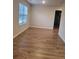 Spacious bonus room with hardwood floors and a window at 4430 Vernon Nw St, Lilburn, GA 30047