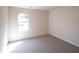 Spacious bedroom with neutral carpet and a window at 820 Tallowtree Ln, Mcdonough, GA 30252