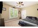 Spacious bedroom with carpeted floors and large window at 341 Allendale Dr, Canton, GA 30115