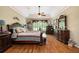 Main bedroom with hardwood floors, a king-size bed, and lots of natural light at 341 Allendale Dr, Canton, GA 30115