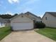 House front with attached garage at 435 Victoria Blvd, Oxford, GA 30054