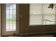 Kitchen with door leading to backyard and broken blinds at 435 Victoria Blvd, Oxford, GA 30054